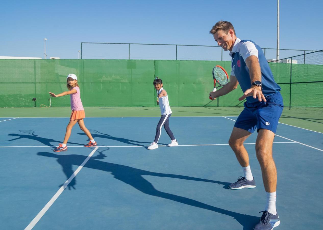 Hotel Park Hyatt Dubai Esterno foto Tennis instructor with children